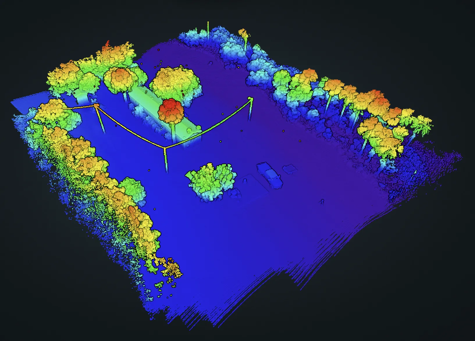 Elevation-colorized LiDAR point cloud of the VLS Construction site: tree lines and structures rendered in a viridis height ramp over level ground.